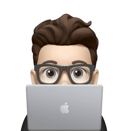 Person peeking from behind a laptop